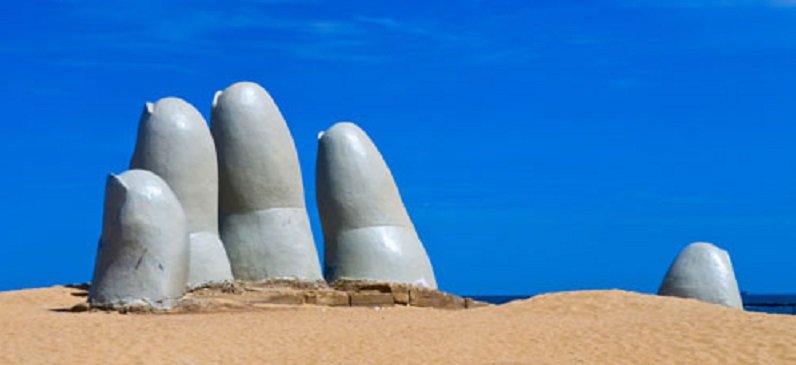 dedos na areia em região do uruguai roteiro Montevideo e Punta del Este